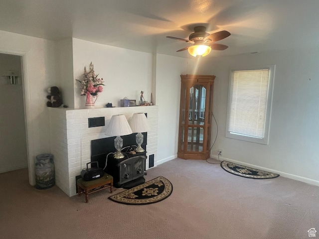 5518 E 500 N, Fort Duchesne, UT 84026 - carpeted living room with ceiling fan and a fireplace