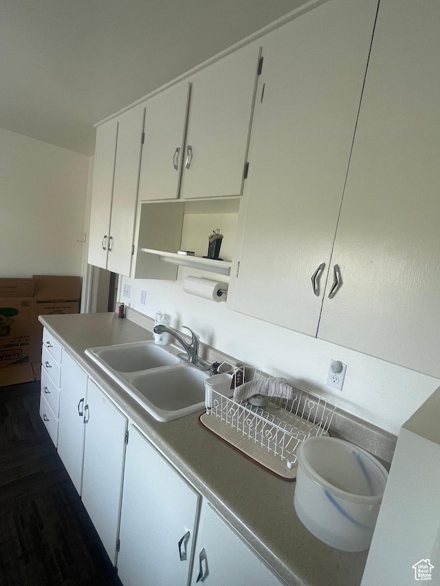 5518 E 500 N, Fort Duchesne, UT 84026 - kitchen featuring white cabinets and dark wood-type flooring