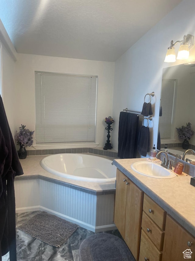 5518 E 500 N, Fort Duchesne, UT 84026 - bathroom with a bath, vanity, and a textured ceiling