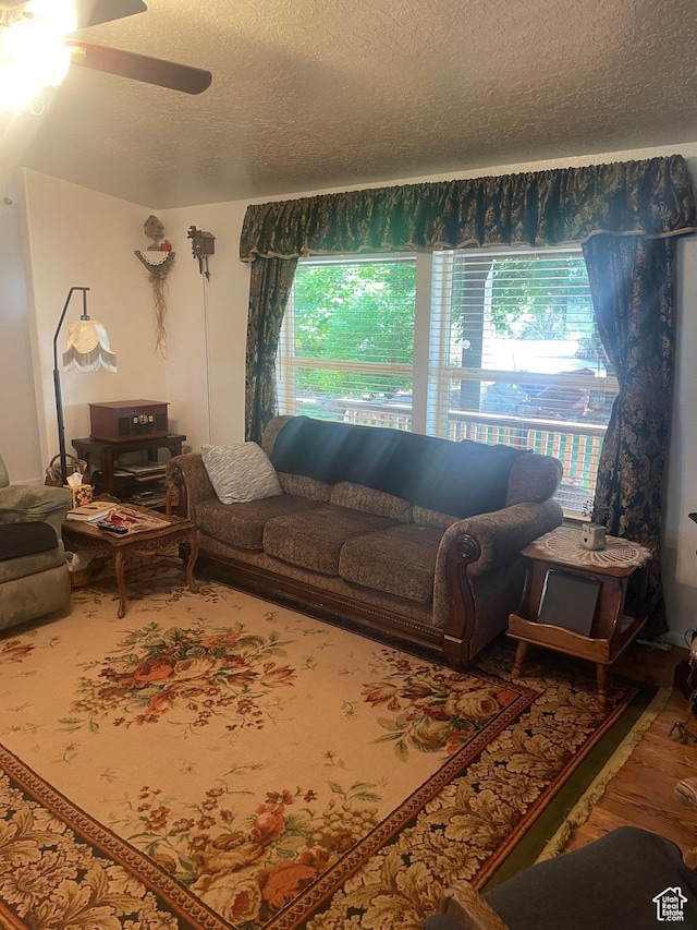 5518 E 500 N, Fort Duchesne, UT 84026 - living area with a textured ceiling, ceiling fan, and wood finished floors