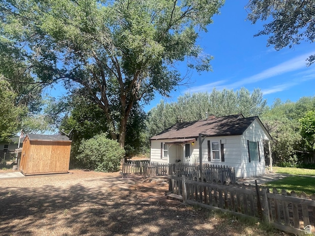 5518 E 500 N, Fort Duchesne, UT 84026 - view of front facade with a storage unit and roof with shingles