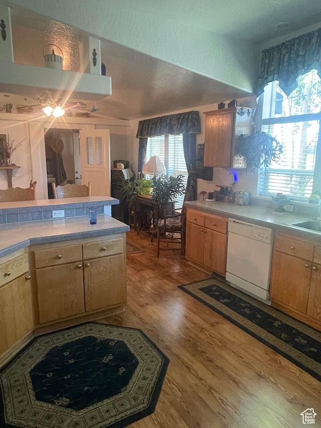 5518 E 500 N, Fort Duchesne, UT 84026 - kitchen with white dishwasher, light countertops, and wood finished floors