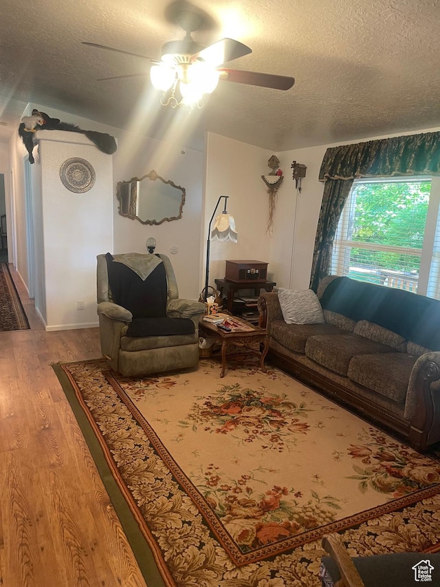 5518 E 500 N, Fort Duchesne, UT 84026 - living area featuring a ceiling fan, a textured ceiling, and wood finished floors