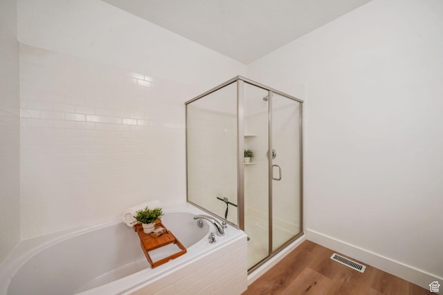 749 E 1600 S, Orem, UT 84097 - bathroom featuring a garden tub, a stall shower, and wood finished floors