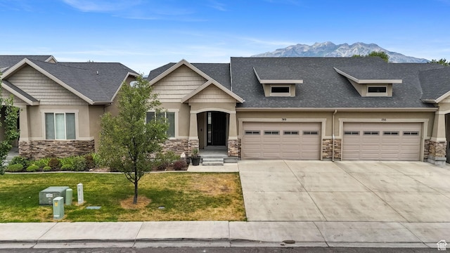 749 E 1600 S, Orem, UT 84097 - craftsman-style home with stone siding, concrete driveway, stucco siding, a front lawn, and a shingled roof