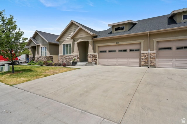 749 E 1600 S, Orem, UT 84097 - craftsman inspired home featuring stone siding, concrete driveway, an attached garage, and stucco siding