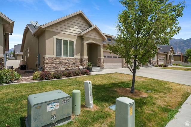 749 E 1600 S, Orem, UT 84097 - craftsman house with stone siding, driveway, stucco siding, a front lawn, and an attached garage