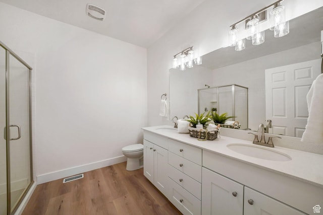 749 E 1600 S, Orem, UT 84097 - bathroom featuring double vanity, a stall shower, and wood finished floors