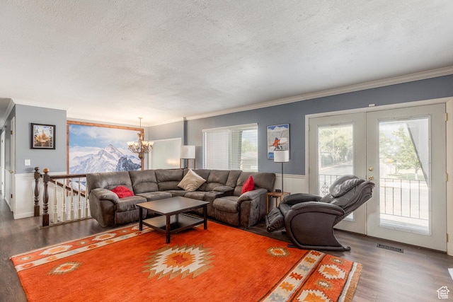8268 S 865 E, Sandy, UT 84094 - living room featuring a textured ceiling, wood finished floors, a chandelier, crown molding, and french doors