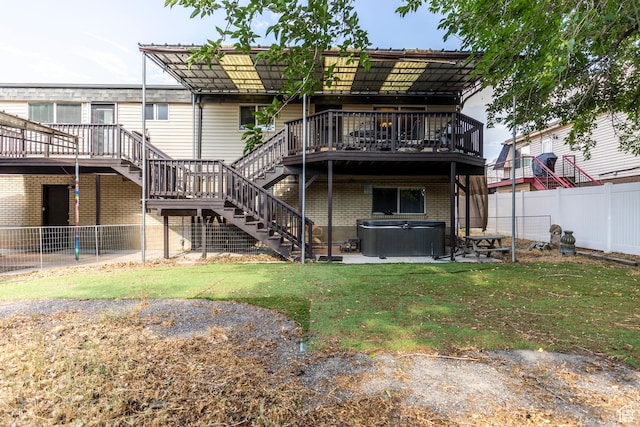 8268 S 865 E, Sandy, UT 84094 - rear view of property featuring a hot tub, stairs, a wooden deck, a fenced backyard, and brick siding