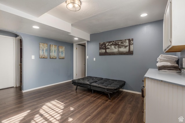 8268 S 865 E, Sandy, UT 84094 - sitting room featuring arched walkways, dark wood-style flooring, and recessed lighting