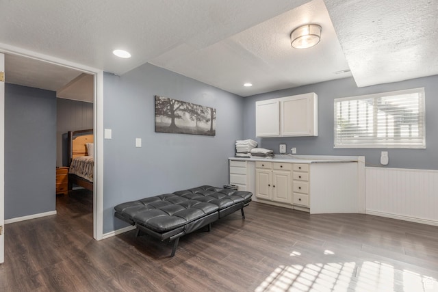 8268 S 865 E, Sandy, UT 84094 - kitchen with a textured ceiling, wood finished floors, white cabinets, light countertops, and a wainscoted wall