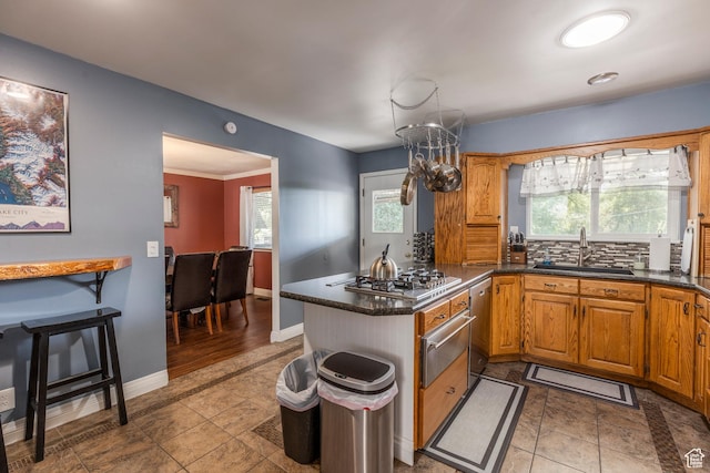8268 S 865 E, Sandy, UT 84094 - kitchen with stainless steel appliances, a warming drawer, a peninsula, brown cabinetry, and backsplash