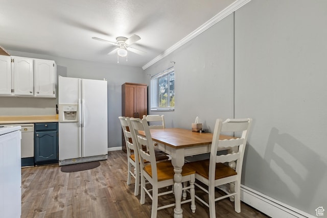 639 E Swenson Ave Unit 4, Springville, UT 84663 - dining space featuring a baseboard heating unit, ceiling fan, crown molding, and wood finished floors