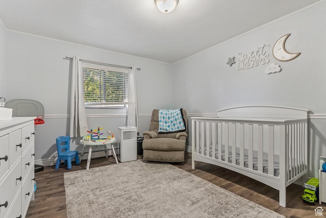 639 E Swenson Ave Unit 4, Springville, UT 84663 - bedroom featuring a baseboard radiator, ornamental molding, dark wood-style flooring, and a nursery area