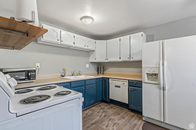 639 E Swenson Ave Unit 4, Springville, UT 84663 - kitchen featuring white appliances, blue cabinets, light wood-type flooring, light countertops, and white cabinetry