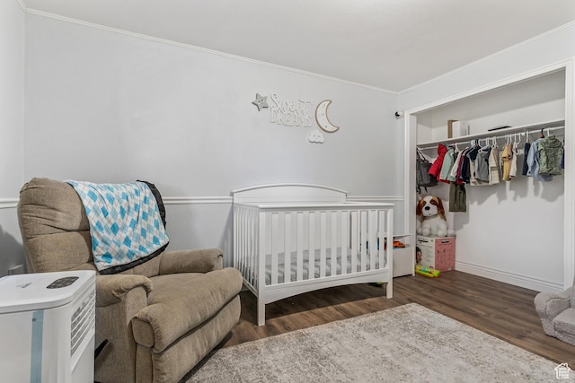 639 E Swenson Ave Unit 4, Springville, UT 84663 - bedroom with wood finished floors, crown molding, a closet, and a crib