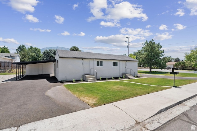 140 W 1200 N, Orem, UT 84057 - view of front of property featuring entry steps, asphalt driveway, a front lawn, an attached carport, and a mountain view