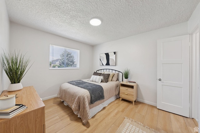 140 W 1200 N, Orem, UT 84057 - bedroom featuring light wood-type flooring and a textured ceiling