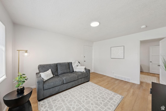 140 W 1200 N, Orem, UT 84057 - living area with light wood finished floors and a textured ceiling