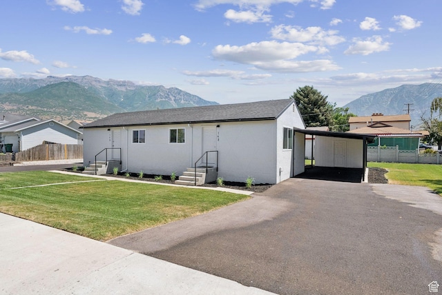 140 W 1200 N, Orem, UT 84057 - view of front facade featuring a mountain view, stucco siding, asphalt driveway, and an attached carport