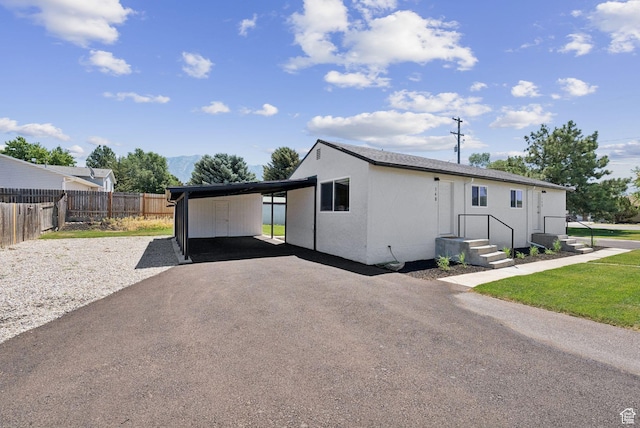 140 W 1200 N, Orem, UT 84057 - view of front of property with driveway, an attached carport, and stucco siding