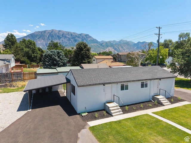 140 W 1200 N, Orem, UT 84057 - single story home featuring a shingled roof, a mountain view, asphalt driveway, and stucco siding