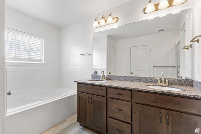 1152 S 800 W, Spanish Fork, UT 84660 - full bathroom with double vanity, a bath, and wood finished floors