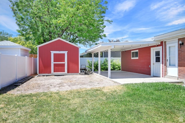 2743 W 7460 S, West Jordan, UT 84084 - fenced backyard with a shed, a patio, and a carport