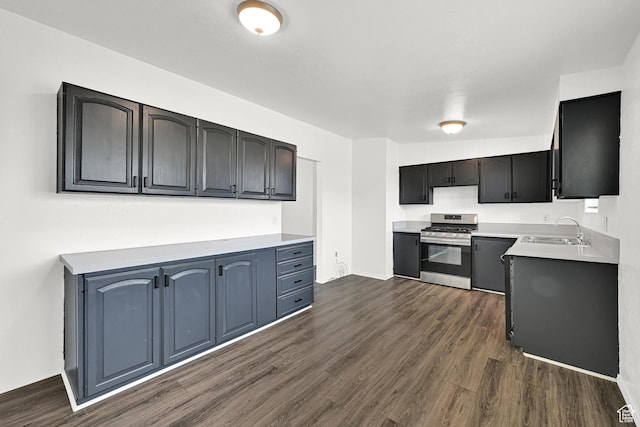 2743 W 7460 S, West Jordan, UT 84084 - kitchen featuring stainless steel gas stove, dark wood-style floors, and light countertops