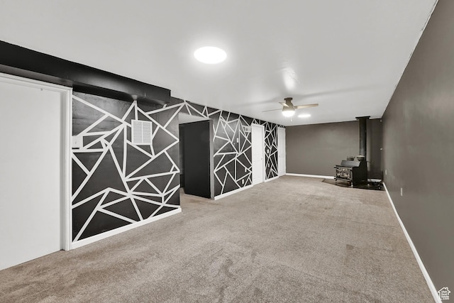 2743 W 7460 S, West Jordan, UT 84084 - empty room with a wood stove, a ceiling fan, and carpet flooring