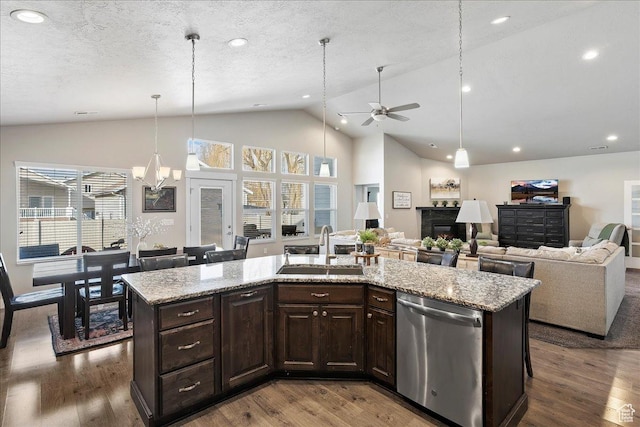 1949 N 2350 W Unit 203, Clinton, UT 84015 - kitchen featuring dishwasher, dark brown cabinets, a fireplace, ceiling fan, and dark wood finished floors