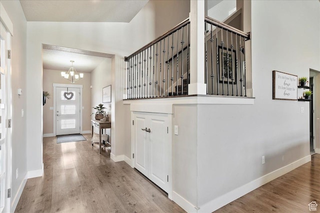 1949 N 2350 W Unit 203, Clinton, UT 84015 - foyer with a chandelier and wood finished floors