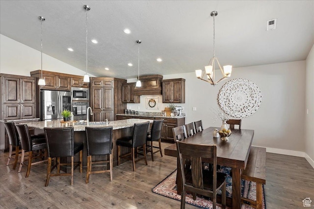 1949 N 2350 W Unit 203, Clinton, UT 84015 - dining space with recessed lighting, a chandelier, lofted ceiling, and dark wood-type flooring