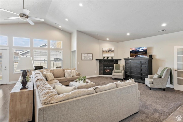 1949 N 2350 W Unit 203, Clinton, UT 84015 - living area with vaulted ceiling, wood finished floors, a glass covered fireplace, ceiling fan, and recessed lighting