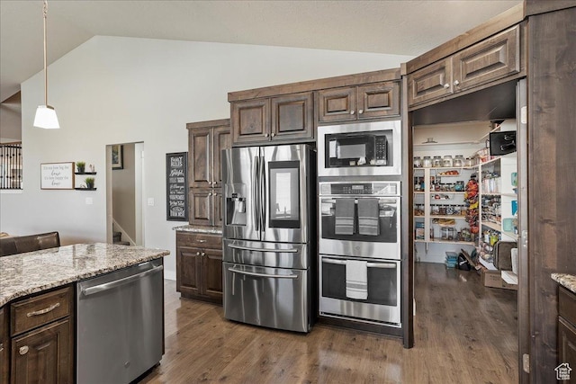 1949 N 2350 W Unit 203, Clinton, UT 84015 - kitchen with stainless steel appliances, wood finished floors, light stone countertops, dark brown cabinets, and high vaulted ceiling