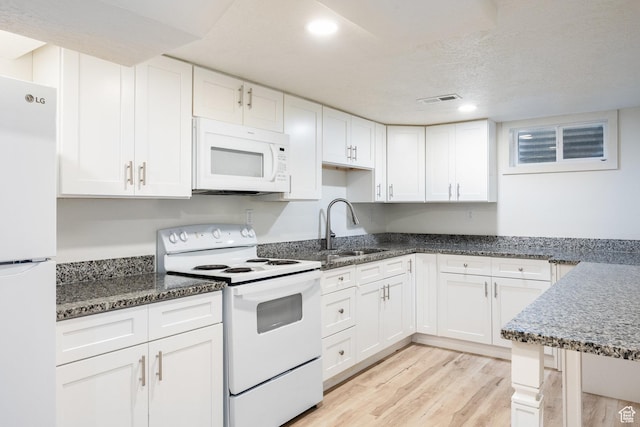 10257 S 1280 E, Sandy, UT 84094 - kitchen featuring white appliances, white cabinets, light wood finished floors, recessed lighting, and a textured ceiling
