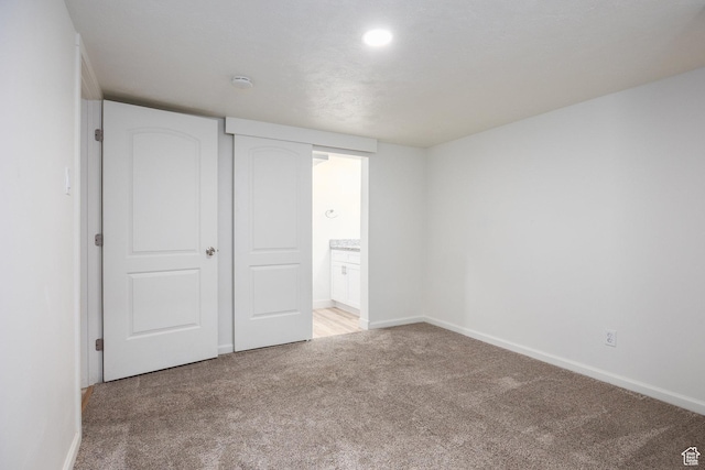 10257 S 1280 E, Sandy, UT 84094 - unfurnished bedroom featuring light carpet and ensuite bath