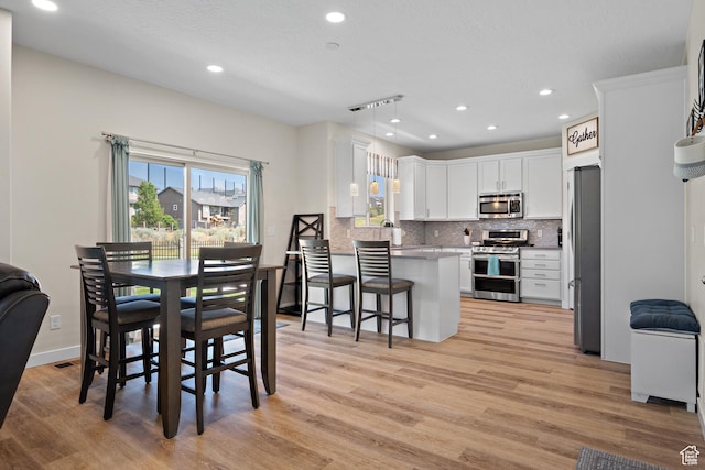 8791 N Suffolk Ln, Eagle Mountain, UT 84005 - dining room featuring light wood-style flooring and recessed lighting
