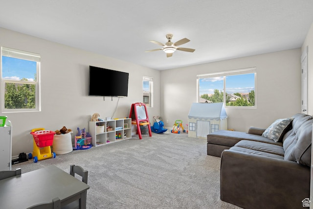 8791 N Suffolk Ln, Eagle Mountain, UT 84005 - carpeted living area featuring a ceiling fan and plenty of natural light