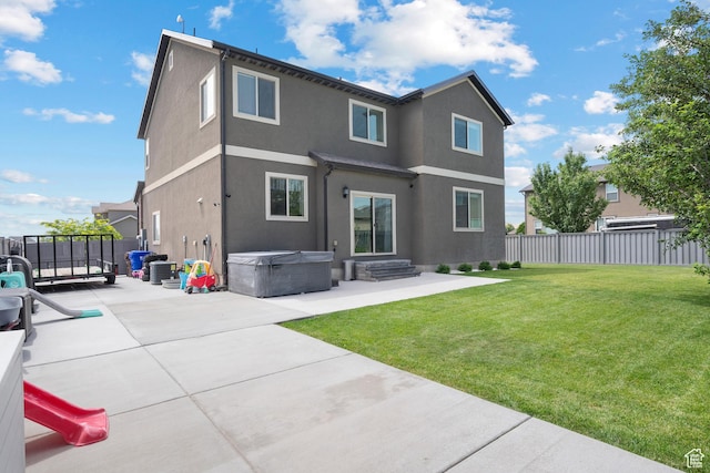 8791 N Suffolk Ln, Eagle Mountain, UT 84005 - rear view of property with a hot tub, a patio area, and stucco siding
