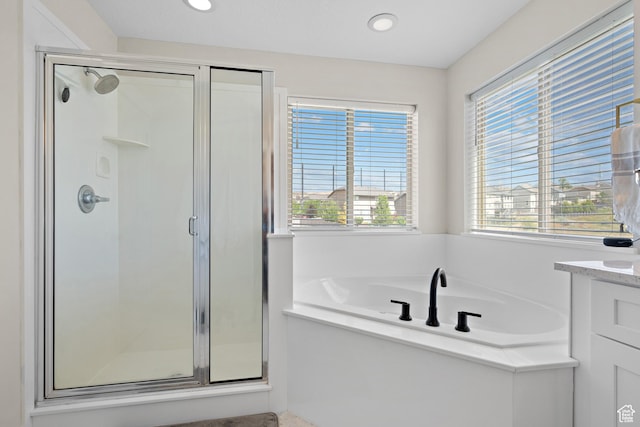 8791 N Suffolk Ln, Eagle Mountain, UT 84005 - bathroom featuring a shower stall, a bath, and recessed lighting
