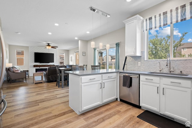 8791 N Suffolk Ln, Eagle Mountain, UT 84005 - kitchen with dishwasher, recessed lighting, a peninsula, light wood-type flooring, and a ceiling fan