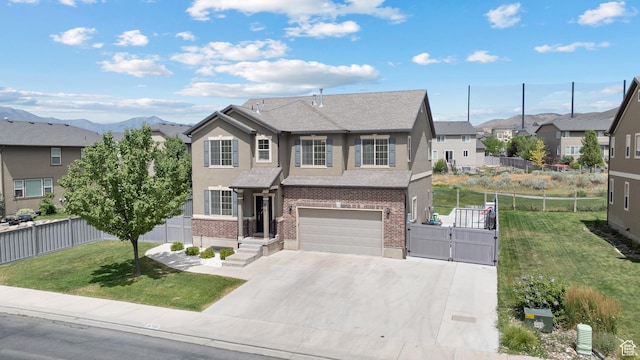 8791 N Suffolk Ln, Eagle Mountain, UT 84005 - view of property with stucco siding, brick siding, an attached garage, concrete driveway, and a residential view