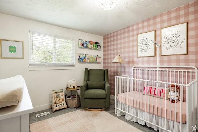 5980 S Sweet Basil W, Taylorsville, UT 84129 - carpeted bedroom with a crib, wallpapered walls, and a textured ceiling