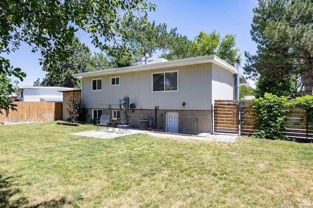 5980 S Sweet Basil W, Taylorsville, UT 84129 - back of property with a fenced backyard, a patio, and a gate