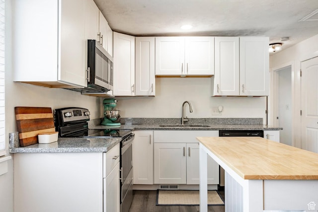 5980 S Sweet Basil W, Taylorsville, UT 84129 - kitchen with stainless steel appliances, white cabinetry, wood counters, and recessed lighting