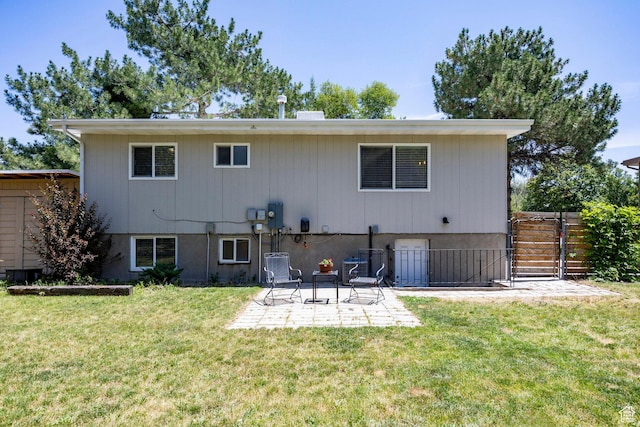 5980 S Sweet Basil W, Taylorsville, UT 84129 - back of house with a patio area and a gate