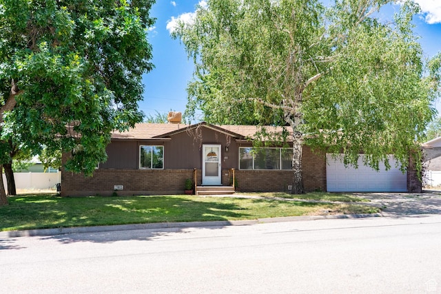 481 W Oak Crest Dr, Monticello, UT 84535 - ranch-style house with brick siding, a garage, a front yard, entry steps, and driveway