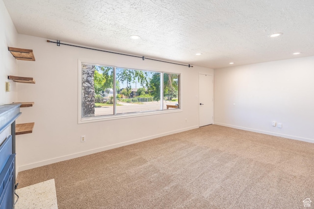 481 W Oak Crest Dr, Monticello, UT 84535 - unfurnished living room featuring recessed lighting, light carpet, and a textured ceiling